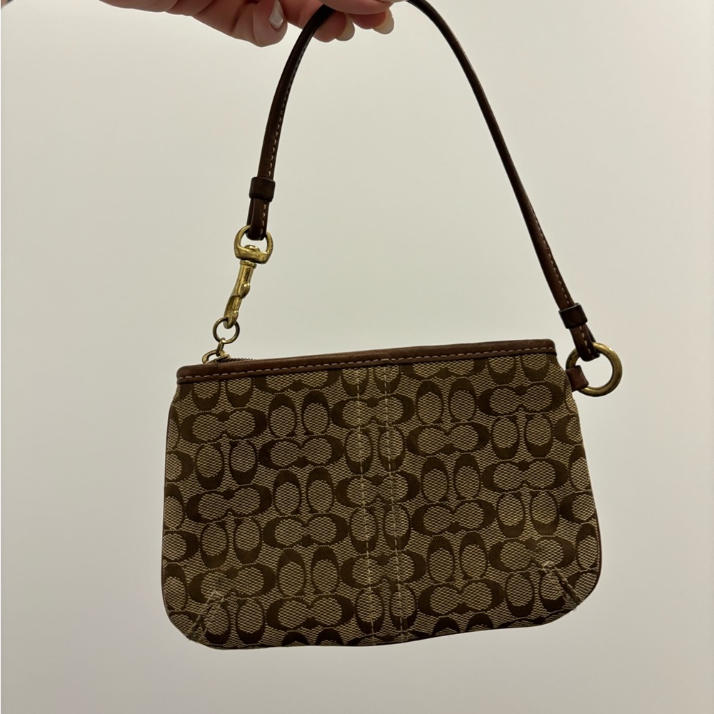 Coach brown monogram wristlet